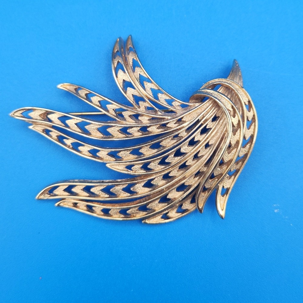 Vintage Monet Gold Tone Abstract Spray Brooch Textured Openwork Wing Pin